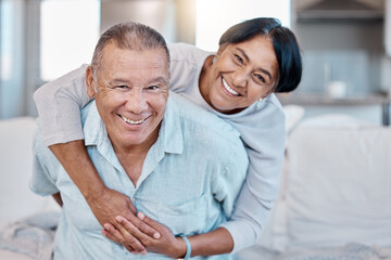Obraz premium Love, retirement and portrait with an old couple in the living room of their home together to relax. Sofa, bonding or marriage with a senior man and woman relaxing in the lounge of their house