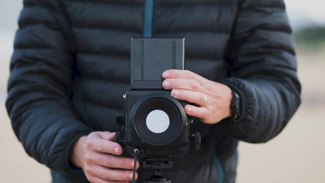 Photographer using a medium format camera