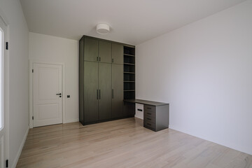 Classical empty room interior. The rooms have wooden floors and gray walls ,decorate with white moulding,there are white window looking out to the nature view.