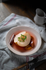 Pear and plum compote in white wine.