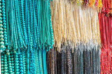 assorted beads of blue turquoise, coral and pearls Asian bazaar