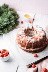 Pouring sugar powder on bundt cake