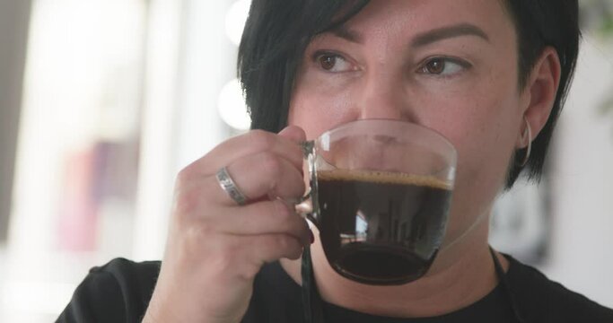 Woman Dreaming While Drinking Black Coffee