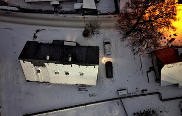 gray roof tiles with windows square slate template. square grid pattern. the lower edge of the roof is formed by a metal strip for framing  better tearing off  layer of snow heat transfer through  