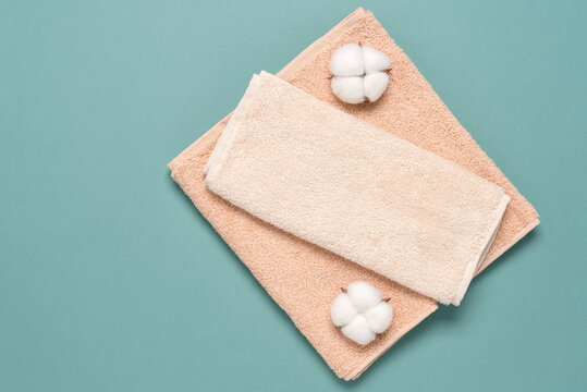 Soft Terry Towels Flat Lay, Turquoise Pastel Background. View From Above.