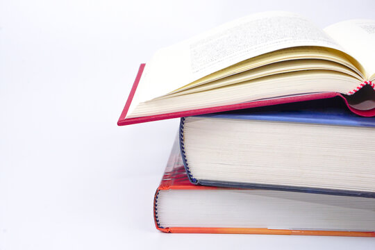 Stack of books on white background. Knowledge and education concept.