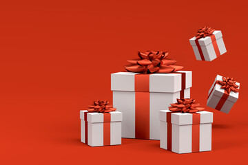 Gift boxes with ribbon and bow for Merry Christmas flying and falling on red