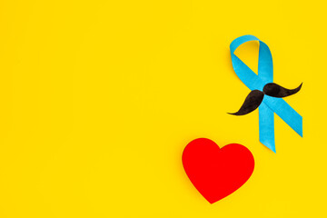 November prostate cancer awareness ribbon with a paper mustache