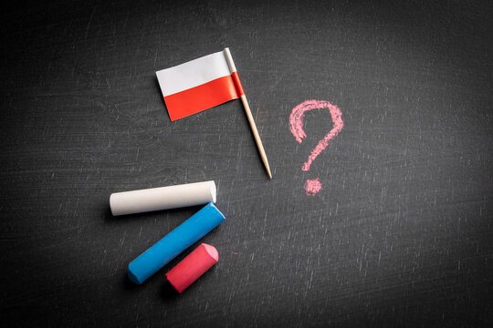 Polish flag and question mark on a chalk board. p Politics and economics concept