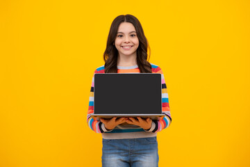 School student using laptop. E-learning and online education. Teen girl on internet video chat isolated on isoalted yellow background. Screen of laptop computer with copy space mockup.