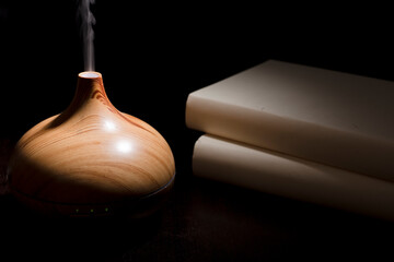 wood fragrance on desk table with steam essence of natural oils