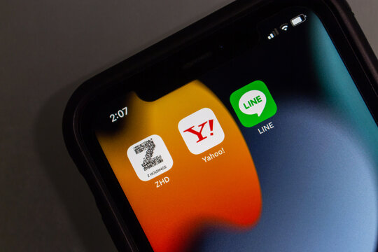 Vancouver, CANADA - Feb 6 2023 : Z Holdings, Yahoo! Japan and LINE app icons seen in an iPhone. In 2023 Feb, Z Holdings announced that will merger with its two owned subsidiaries, Yahoo Japan and LINE