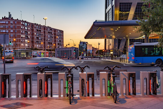 Madrid Spain. Parking for bicycle rental in Plaza Castilla next to the bus station. Dusk. Long exposure