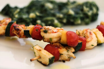 Delicious seafood dish from traditional Croatia islands cuisine - mixed fish skewer with cod fish,...