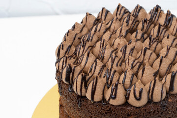 Wonderful Chocolate Naked cake with a cream topping and chocolate syrup made with love.