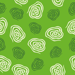 Spirals seamless vector pattern. Vector image on green background