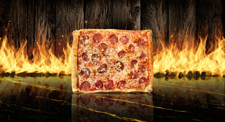 Square peperoni pizza on marble top with flaming wood background