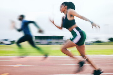 Black woman, running and athletics in sports race for training, cross fit or exercise in blur on stadium track. African American female runner athlete in fitness, sport or speed run for competition