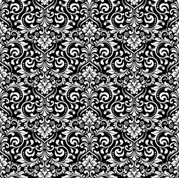 Floral pattern. Vintage wallpaper in the Baroque style. Seamless vector background. White and black ornament for fabric, wallpaper, packaging. Ornate Damask flower ornament