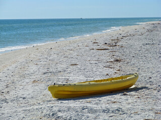 A yellow Boat on Beach Sanibel Florida
