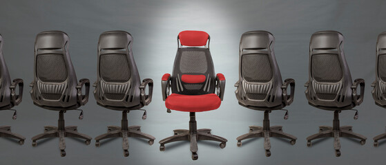 We are hiring concept with empty office chair among the back view