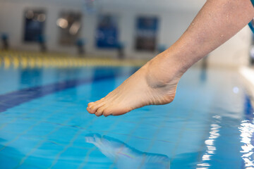 Close up picture of legs under water at the swimming pool