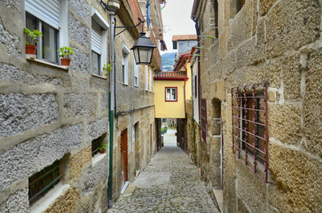Old street in the heart of the tradition of tanning and beating hides in Guimaraes, Portugal