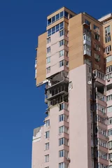 Deurstickers Russian missile damaged multi-storey dwelling building in Kiev city, Ukraine © Harmony Video Pro