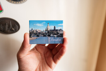 Dresden, Germany souvenir refrigerator magnet at hand.