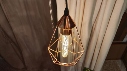 Metal geometric lamp chandelier lamp in loft style and beige curtains