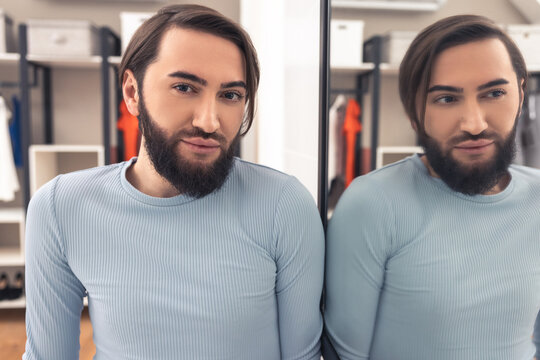 Male person wearing the natural makeup on his face indoors