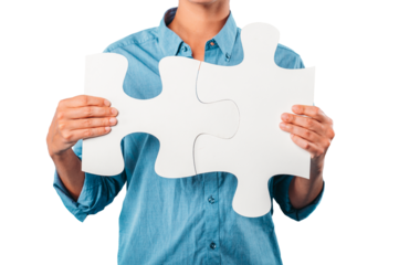 woman joins two puzzle pieces. concept teamwork, partnership, integration
