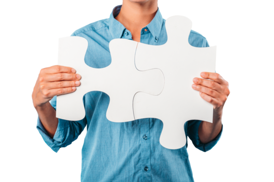 woman joins two puzzle pieces. concept teamwork, partnership, integration