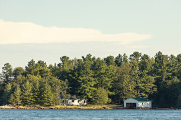 Fototapeta na wymiar Beautiful scenery of Thousand Islands National Park, house on the river, Ontario, Canada