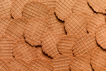 Round chocolate wafer texture background. Delicate waffle cookie pattern, thin Belgian waffle...