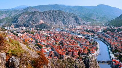 Old Ottoman houses panoramic view by the Yesilirmak River in Amasya City. Amasya is populer tourist destination in Turkey. - 569535304