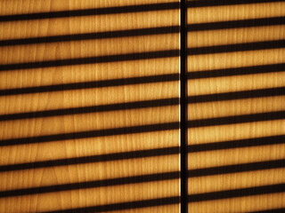 blinds shadow on wooden wall background