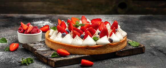Homemade tart pie or cake with whipped cream and fresh Strawberry. Long banner format