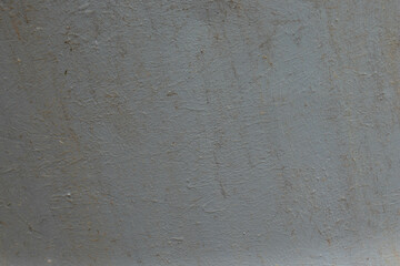 Part of the grey painted metal barrel. Old rusted metal. Metal weathered surface. Close up view.