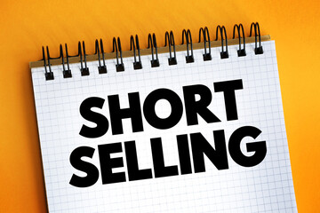 Short Selling - sale of a stock you do not own, text concept on notepad