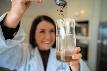 Soil test, female agricultural scientist conducting a soil test in a scientific lab in. soil agricultural agronomist in australia, soil microbial test in a scientific lab. Soil microbes