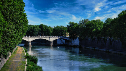 Fototapeta na wymiar Bridge over Tiber river in Rome Italy
