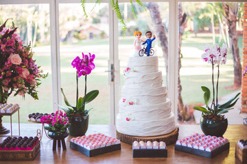 cake table with cake and flowers