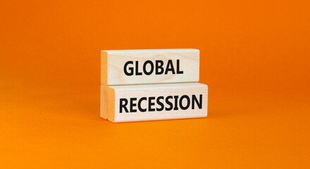 Global recession symbol. Concept words Global recession on wooden blocks. Beautiful orange table orange background. Business and global recession concept. Copy space.