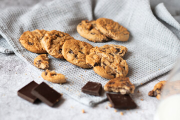 Cookies with pieces of chocolate. On a gray background