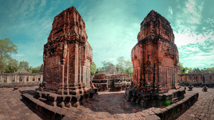 A tourist walk to Prasat Muang Tam historical park at Buriram Province, Thailand. Khmer castle architecture in fantastic archaeological site from thousand years ago.
