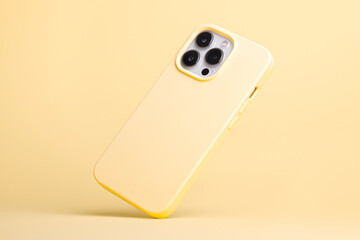 iPhone 13 and 14 Pro Max in yellow banana soft silicone case falls down back view, phone case...