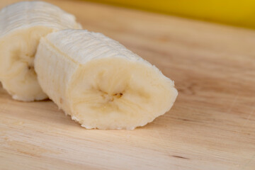 a ripe sweet banana cut into pieces lies on the table