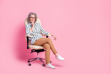 Fototapeta premium Full length photo of adorable cute woman dressed smart casual arm chin sitting leather office chair isolated pink color background