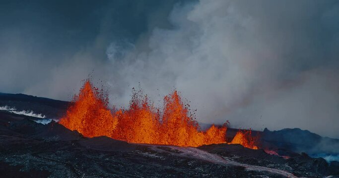 Volcano erupting molten hot lava fountain, Hawaii Mauna Loa volcano eruption of 2022